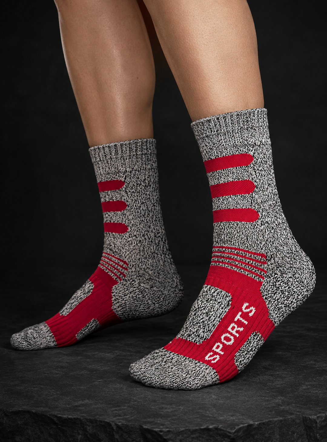 Red and grey HOTPOT hiking socks worn on feet